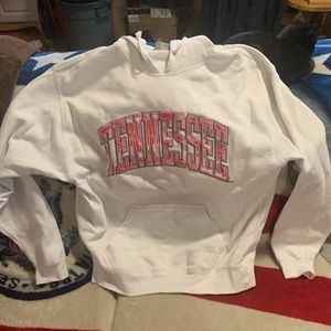 White Tennessee sweater with pink wording.